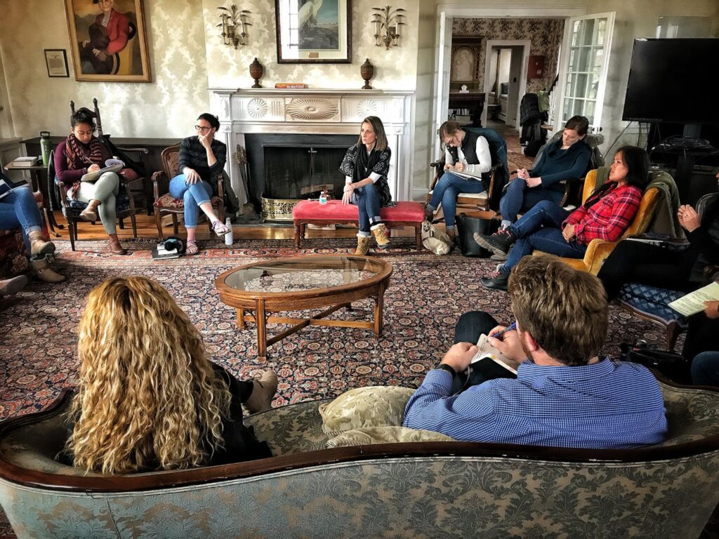 The group of participants share their work at a week-long War Horse writing seminar taught by David Chrisinger, at the Carey Institute for Global Good, in Rensselaerville, NY, November 2018. 